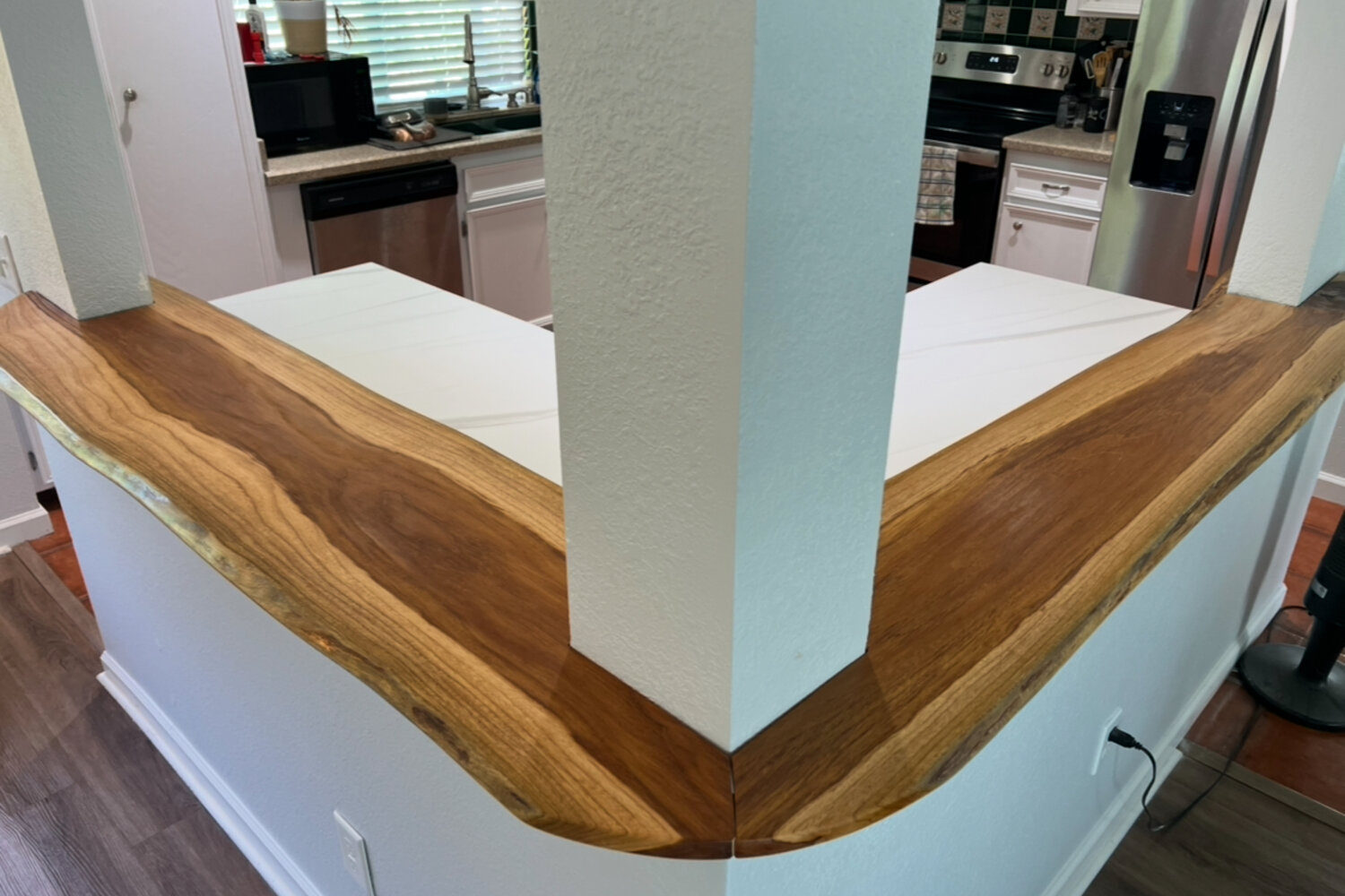 Finished wood countertop detail in an updated kitchen
